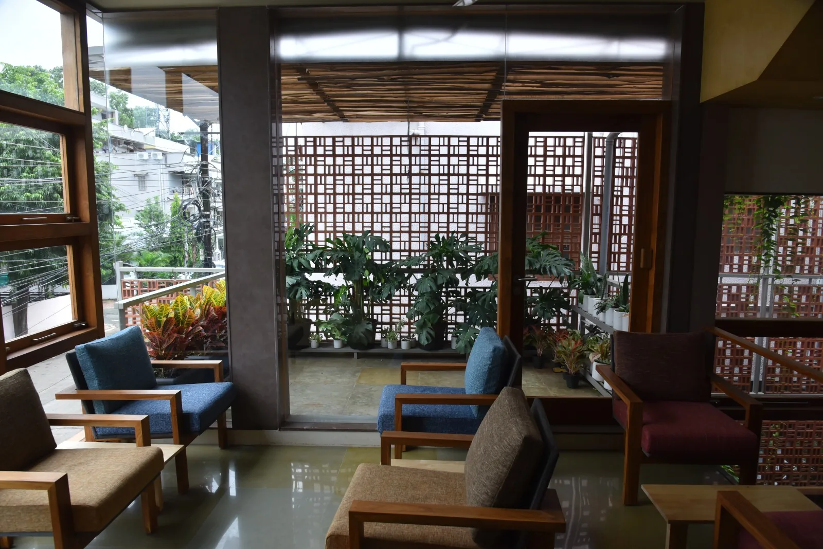 Lounge seating next to a balcony garden