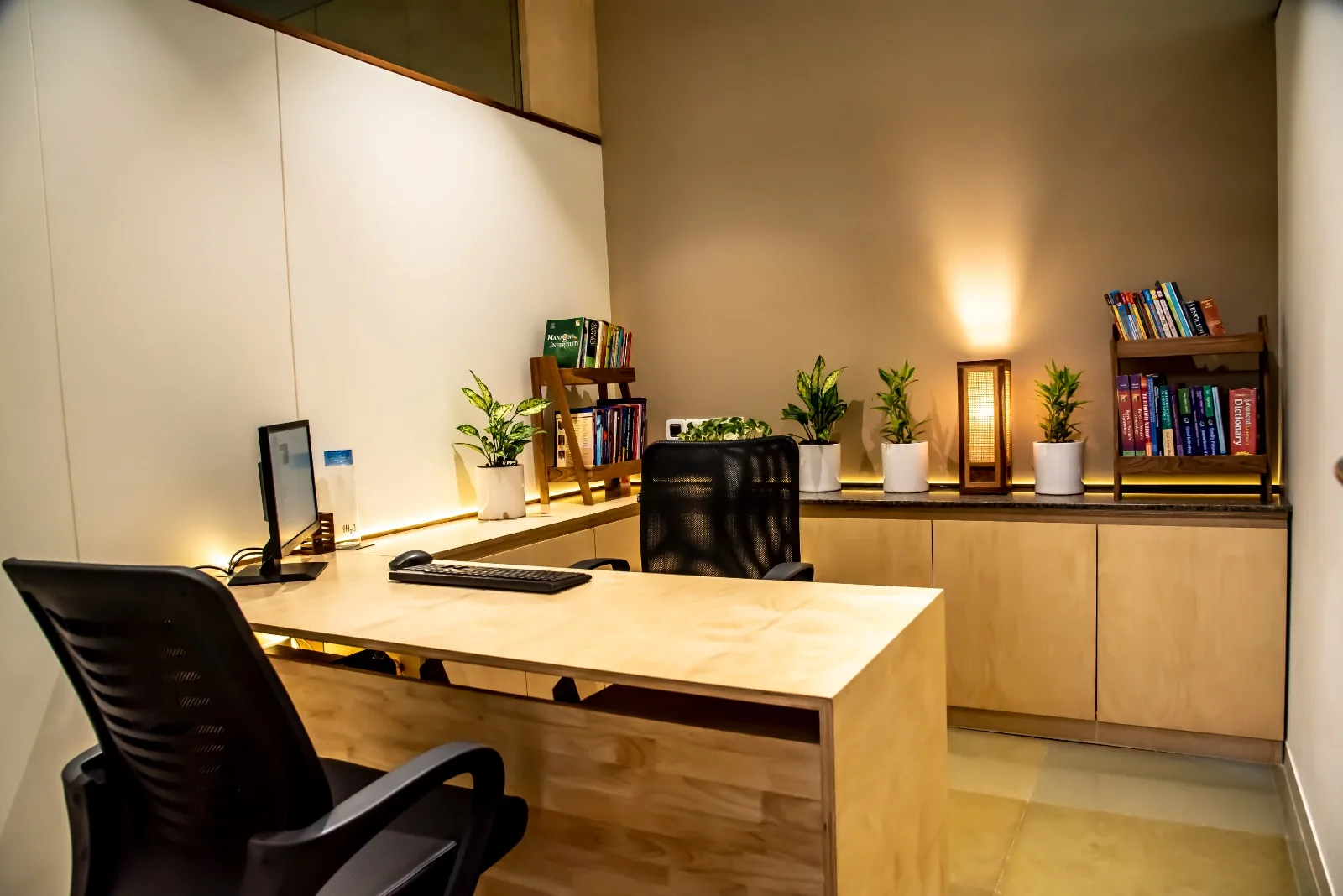 Private counseling room with desk and bookshelves